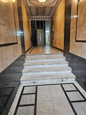a hallway with stairs in a building with a door at Apartman Viktor 2 Jacuzzi in Belgrade