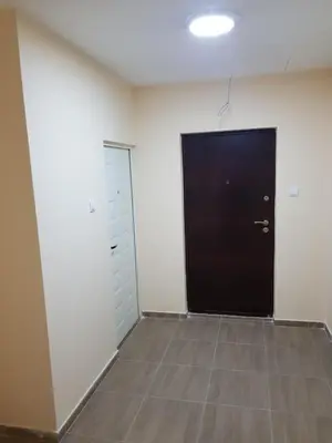 a room with a black door and a tile floor at Apartman Viktor 2 Jacuzzi in Belgrade
