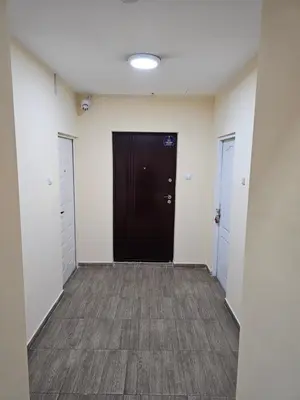 a hallway with a black door in a building at Apartman Viktor 2 Jacuzzi in Belgrade