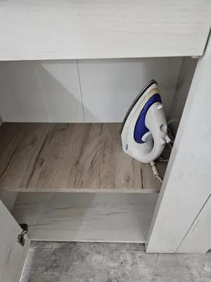 a cabinet with a toilet in the middle of a room at Apartman Viktor 2 Jacuzzi in Belgrade