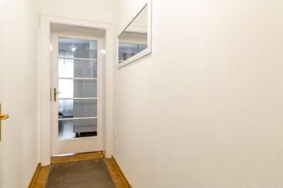 a hallway with a door and a window at 1st Belgrade Apartment in Belgrade