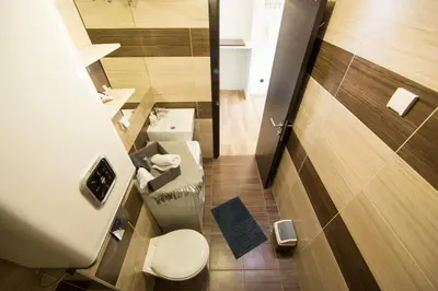 a small bathroom with a toilet and a sink at Ahoy Belgrade Luxury Apartment in Belgrade