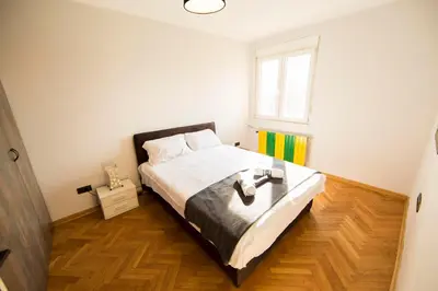 a bedroom with a bed and a window at Ahoy Belgrade Luxury Apartment in Belgrade