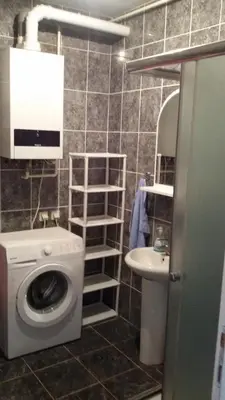 a bathroom with a washing machine and a sink at Lili in Arandjelovac