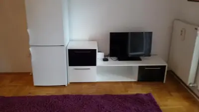 a white refrigerator and a tv on a desk at Lili in Arandjelovac