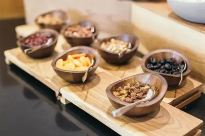 a group of bowls filled with different types of food at Central Point Hotel Beograd in Belgrade