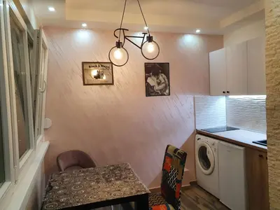 a kitchen with a washer and dryer in a room at EXCLUSIVE Apartment in Belgrade