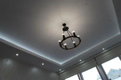 a chandelier hanging from a ceiling in a room at EXCLUSIVE Apartment in Belgrade