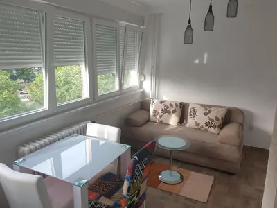 a living room with a couch and a table at EXCLUSIVE Apartment in Belgrade