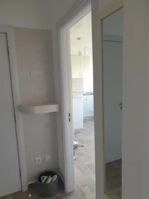 a room with a door and a mirror in a room at EXCLUSIVE Apartment in Belgrade