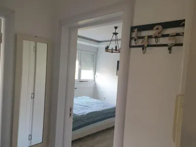a bedroom with a bed and a mirror at EXCLUSIVE Apartment in Belgrade