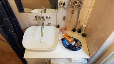 a bathroom with a sink and a shower at Liberty in Belgrade