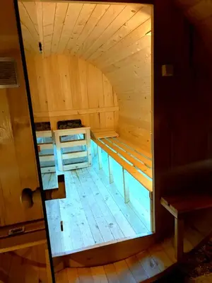 an inside view of a sauna with the door open at Sunčana Strana Fruške Gore - veliko imanje sa kucom za odmor in Velika Remeta