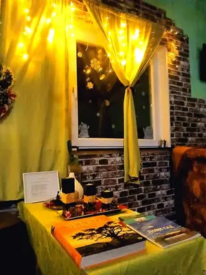 a room with a table with a window with lights at Sunčana Strana Fruške Gore - veliko imanje sa kucom za odmor in Velika Remeta