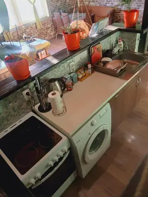 a kitchen with a stove and a sink at Sunčana Strana Fruške Gore - veliko imanje sa kucom za odmor in Velika Remeta