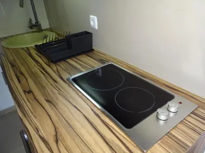 a kitchen with a counter top with a sink at Blue Apartment in Belgrade