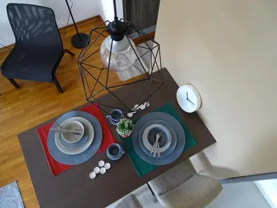 an overhead view of a table with plates on it at Blue Apartment in Belgrade