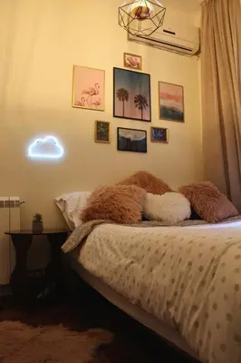 a bedroom with a bed with pillows on it at 1BR Flat in Heart Of Belgrade With Panoramic Central View in Belgrade