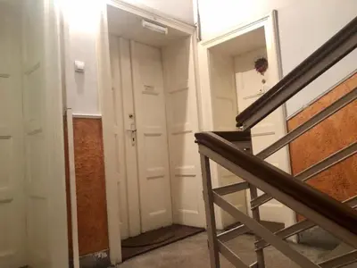 a stairway with a door and a mirror at 1BR Flat in Heart Of Belgrade With Panoramic Central View in Belgrade