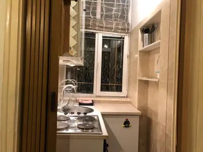 a small kitchen with a stove and a window at 1BR Flat in Heart Of Belgrade With Panoramic Central View in Belgrade