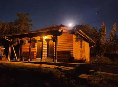 a small wooden house with a light on top at Vajat Orašac in Arandjelovac
