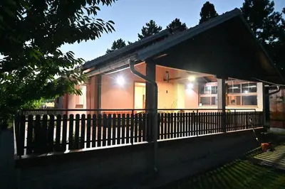 a house with a fence in front of it at Teja-seosko turističko domaćinstvo in Arandjelovac