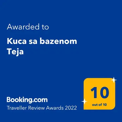 a yellow sign with the text awarded to kuna sa barcelona telegram at Teja-seosko turističko domaćinstvo in Arandjelovac