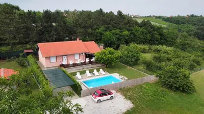 an aerial view of a house with a swimming pool at Teja-seosko turističko domaćinstvo in Arandjelovac