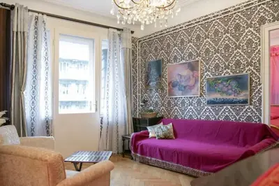 a living room with a purple couch in a room at FABOULOUS apartment in Belgrade