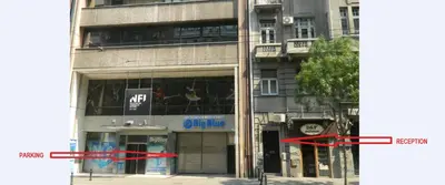 a building with two red arrows in front of it at Authentic Belgrade Centre Apartment #3, Four Bedrooms and Two full Bathrooms in Belgrade
