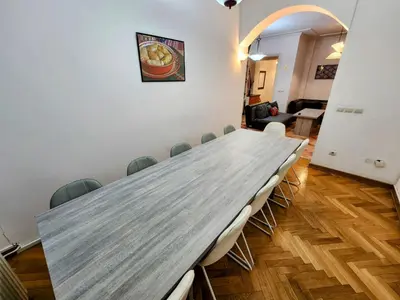 a conference room with a long table and chairs at Authentic Belgrade Centre Apartment #3, Four Bedrooms and Two full Bathrooms in Belgrade