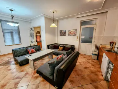 a living room with two couches and a table at Authentic Belgrade Centre Apartment #3, Four Bedrooms and Two full Bathrooms in Belgrade