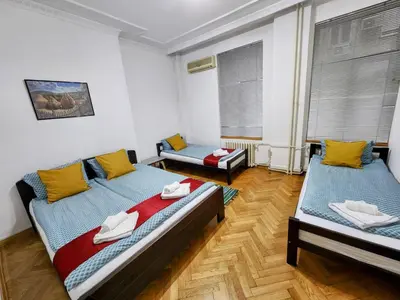 a room with two beds in a room at Authentic Belgrade Centre Apartment #3, Four Bedrooms and Two full Bathrooms in Belgrade