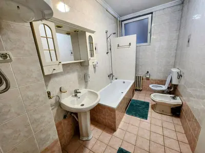 a bathroom with a tub and a sink and a toilet at Authentic Belgrade Centre Apartment #3, Four Bedrooms and Two full Bathrooms in Belgrade