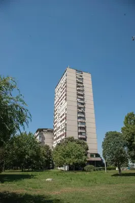 a tall building with trees in front of it at Sensational view - Zemun in Belgrade