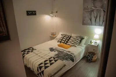 a small bedroom with a bed with pillows on it at Sensational view - Zemun in Belgrade