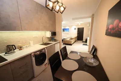 a kitchen with a table and a dining room at Goliath in Belgrade