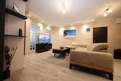 a living room with a couch and a flat screen tv at Goliath in Belgrade