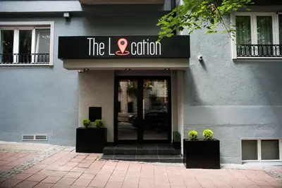 a building with a sign that reads the station at The Location Hotel in Belgrade