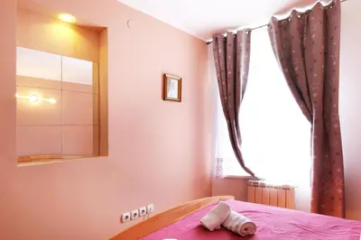 a bedroom with a bed and a mirror at Villa Tower Gardos in Belgrade