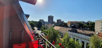 a balcony of a building with a view of a city at Julija in Pančevo