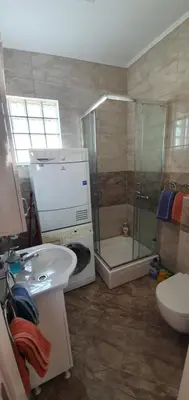a bathroom with a shower and a sink and a toilet at Julija in Pančevo
