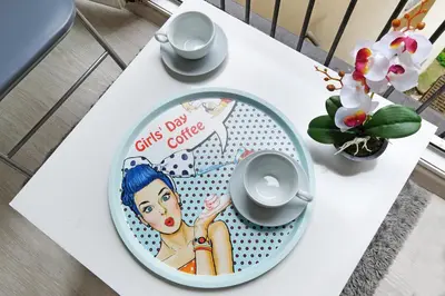 a white table with a plate with a girl on it at Apartment Paradise Fantasy in Belgrade