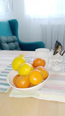 a bowl of oranges sitting on a table at BLUE DANUBE in Belgrade