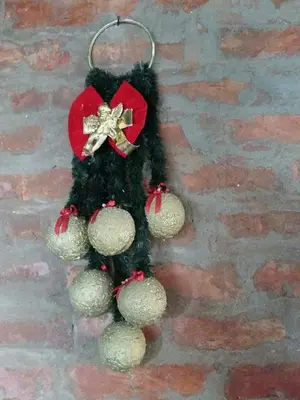 a christmas tree with balls and a bow on it at Kuća na dan Villa Holiday in Sakule