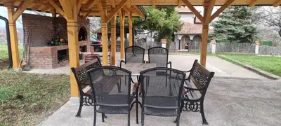 a group of chairs sitting at a table under a gazebo at Vinogradski konak Belgrade, Sopot,Kosmaj in Sopot