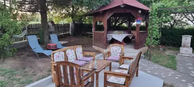 a group of chairs and a gazebo with a table at Vinogradski konak Belgrade, Sopot,Kosmaj in Sopot