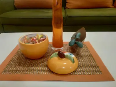 a table with a bowl of food on a table at Nika Apartment in Belgrade