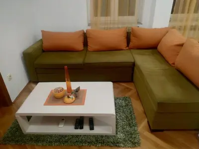 a living room with a couch and a table at Nika Apartment in Belgrade