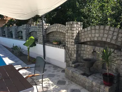 a brick wall with an outdoor fire place at Apartmani Spasić in Smederevo